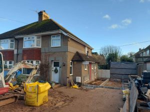 On site front elevation photo of Swell Architecture project for a two storey side extension in Seaton Devon.jpg